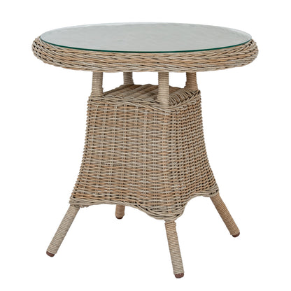 Round wicker table with glass top on a white background