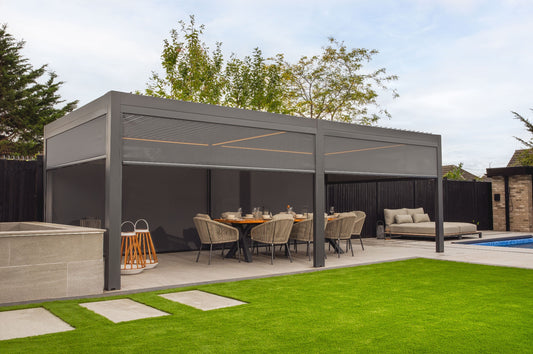 Outdoor patio area with a pergola, table, chairs, and a pool.